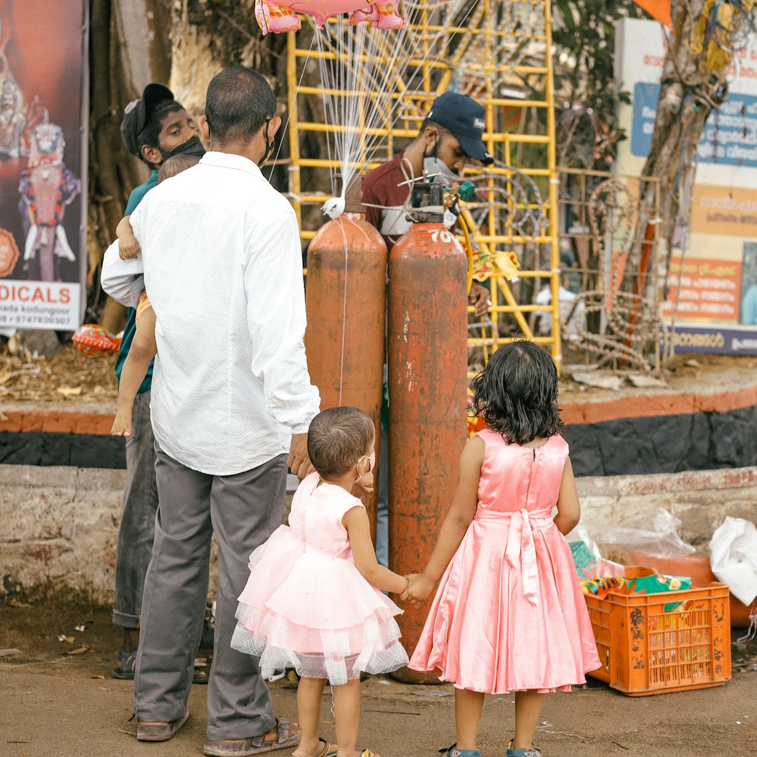 a group of people standing around a fire hydrant