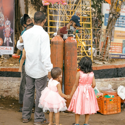 a group of people standing around a fire hydrant